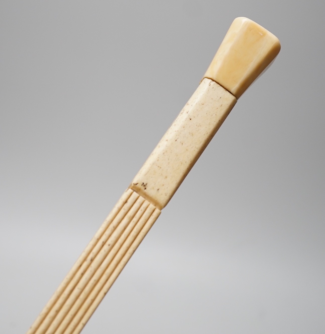An early 19th century carved scrimshaw whalebone walking cane, 93cms